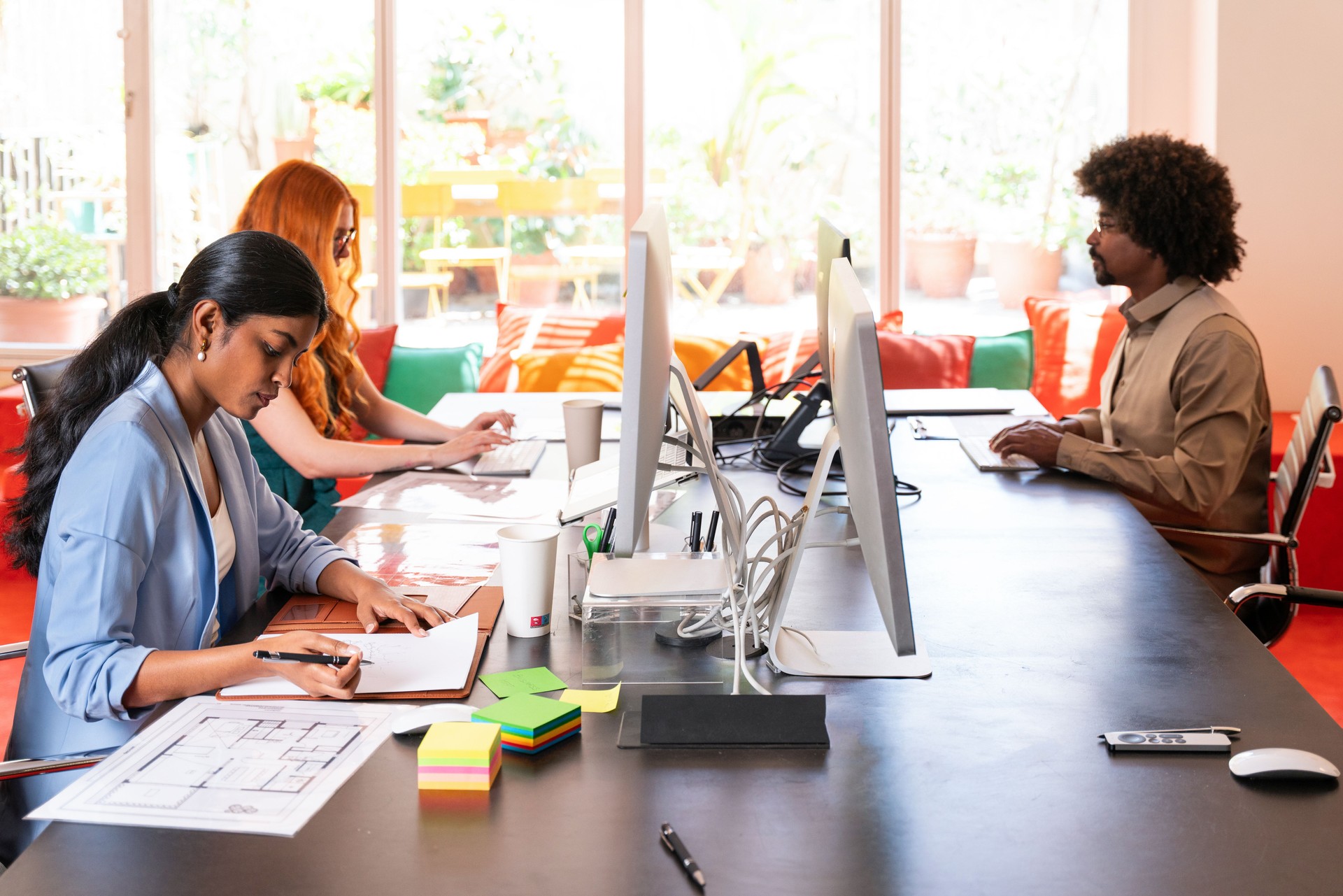 Multiethnic small group of businesspeople meeting in a coworking company office